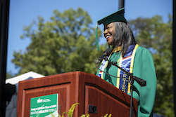 Image of Caprecia Miller speaking to the 2021 and 2020 graduating classes.