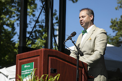 Image of Kevin Cevasco speaking in front of 2021 and 2020 graduating classes.