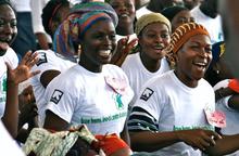 Women participate in an event to launch an anti-domestic violence campaign sponsored by the IRC in Abidjan, Côte d’Ivoire. 