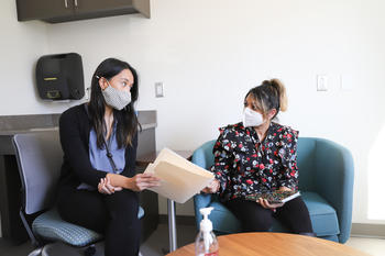 Image of nurse consulting with patient 